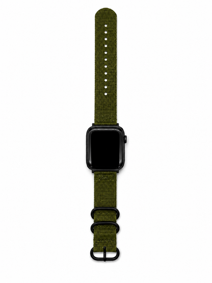 An olive green woven nylon watch band with black hardware, shown attached to a black smartwatch on a plain white background.
